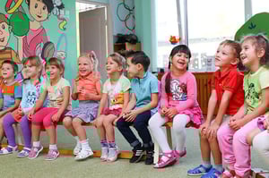 Children are sitting on bench